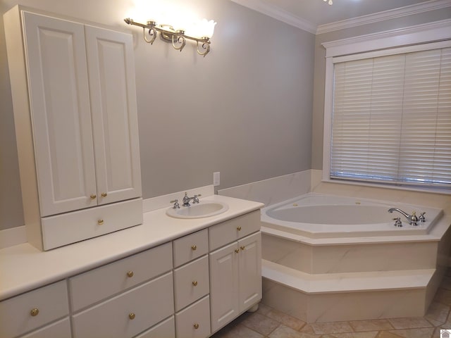 bathroom featuring crown molding, vanity, and a tub