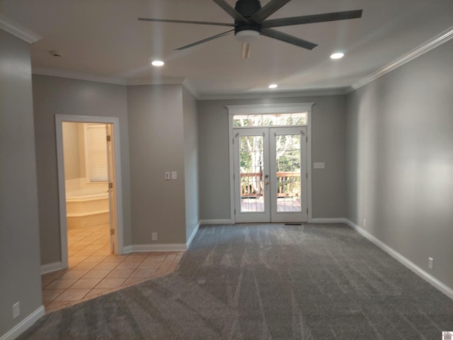 empty room with ceiling fan, ornamental molding, light carpet, and french doors