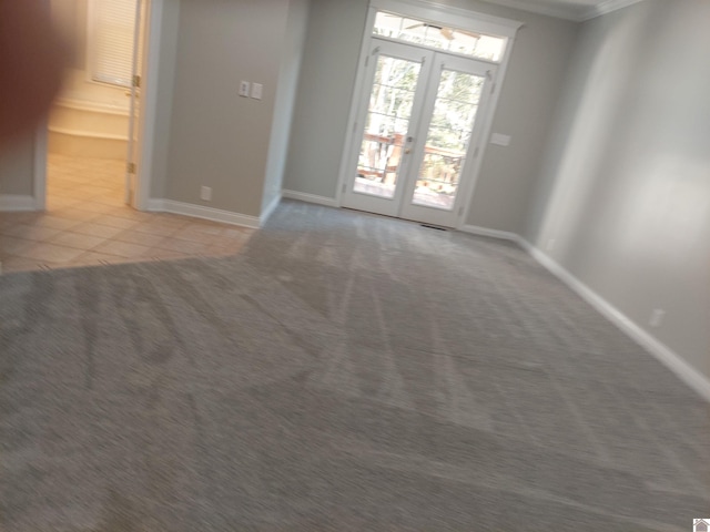 interior space featuring french doors and light colored carpet