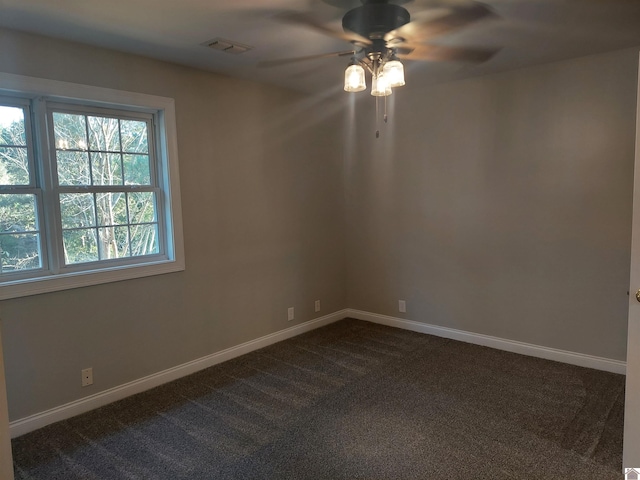 carpeted empty room featuring ceiling fan