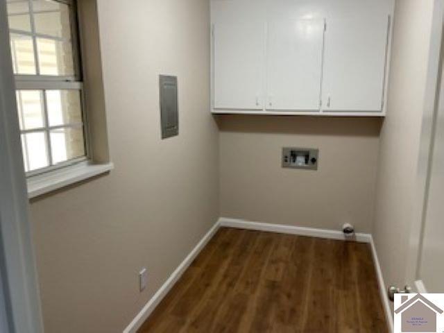 clothes washing area featuring dark hardwood / wood-style flooring, cabinets, and hookup for a washing machine