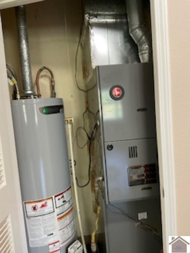 utility room with gas water heater