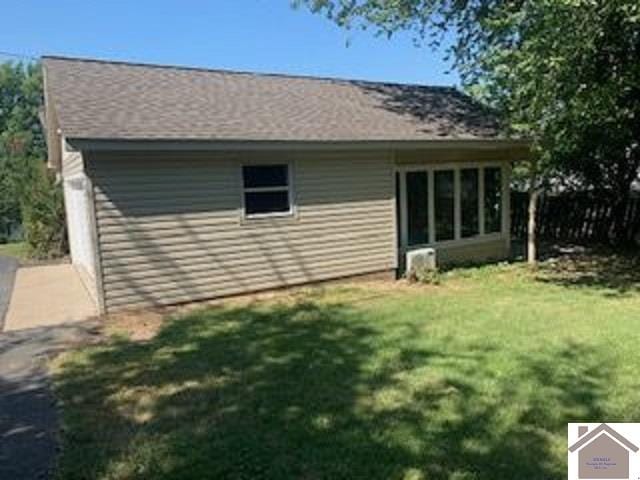 view of home's exterior featuring a lawn