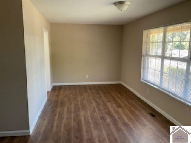 spare room with hardwood / wood-style floors