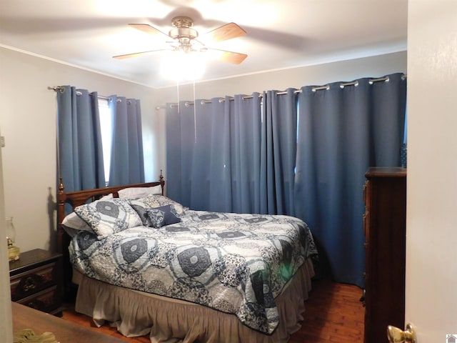 bedroom with ceiling fan and wood-type flooring