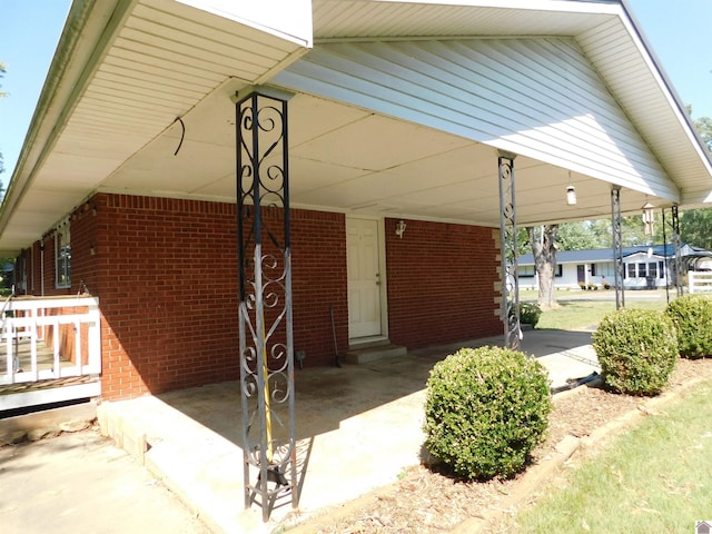 view of patio / terrace featuring a carport