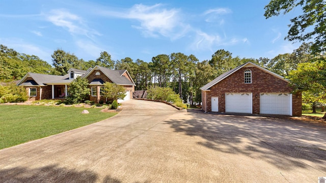 view of front facade with a garage and a front lawn