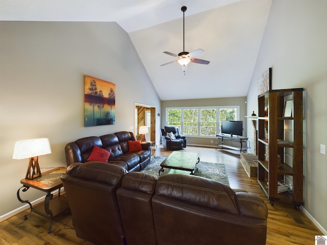 living room featuring ceiling fan, hardwood / wood-style flooring, and high vaulted ceiling