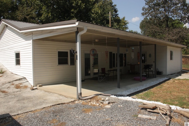 rear view of property featuring a patio area