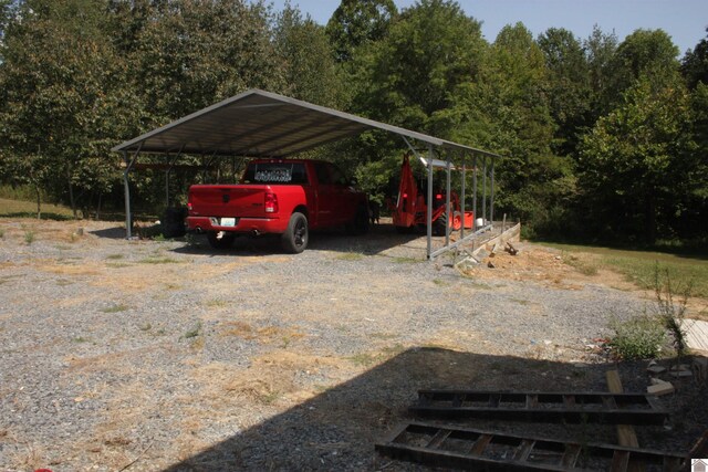 view of vehicle parking with a carport