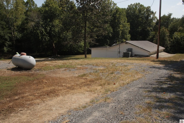 view of yard with central air condition unit