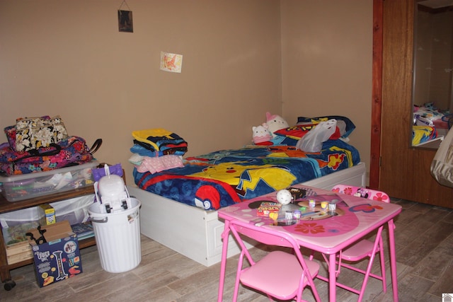 bedroom featuring hardwood / wood-style floors