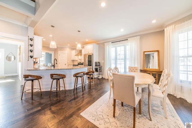 dining space with dark hardwood / wood-style floors