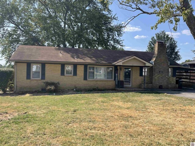 ranch-style house with a front lawn