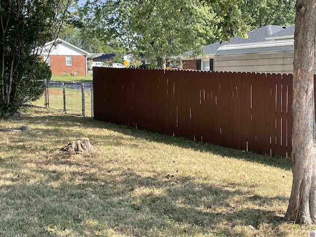 view of yard with a gate and fence