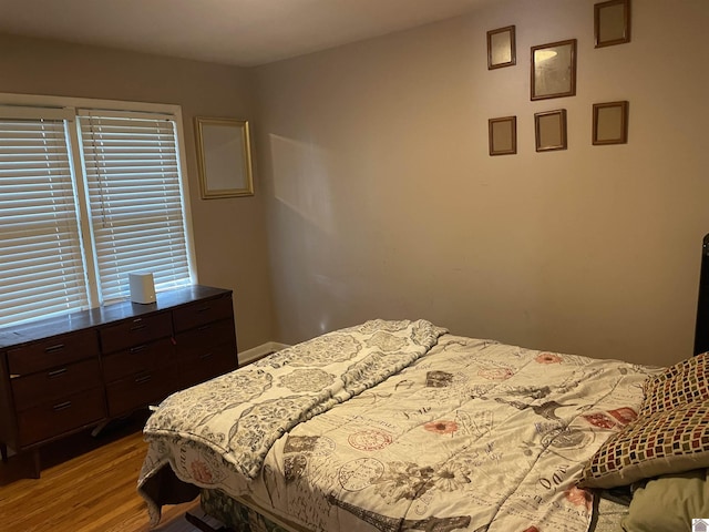 bedroom with wood finished floors