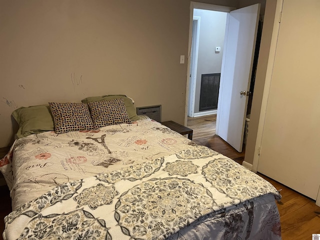 bedroom featuring wood finished floors