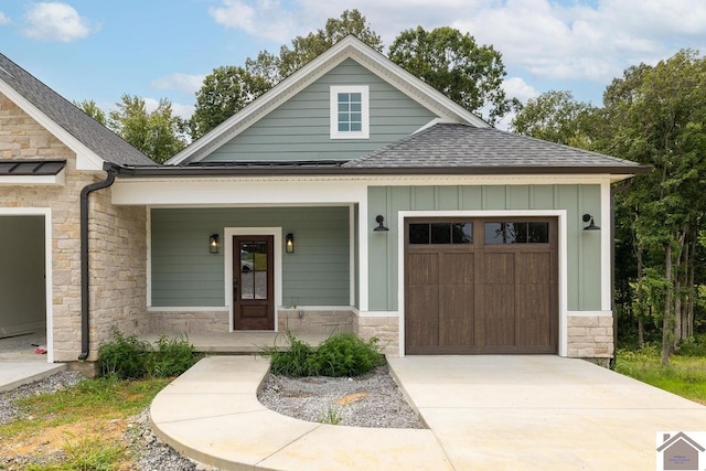 view of front of house featuring covered porch and a garage