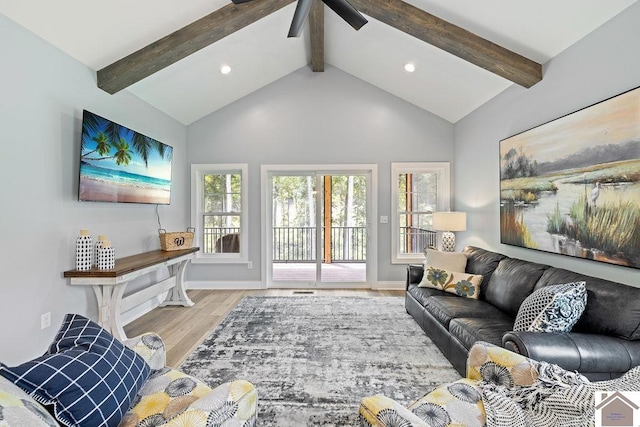 living room with high vaulted ceiling, light hardwood / wood-style floors, beamed ceiling, and ceiling fan