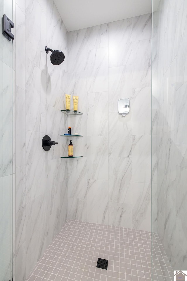 bathroom with a tile shower