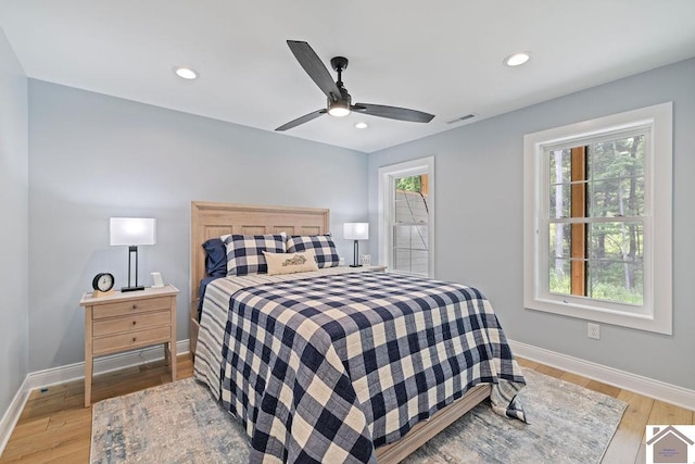 bedroom with hardwood / wood-style flooring and ceiling fan