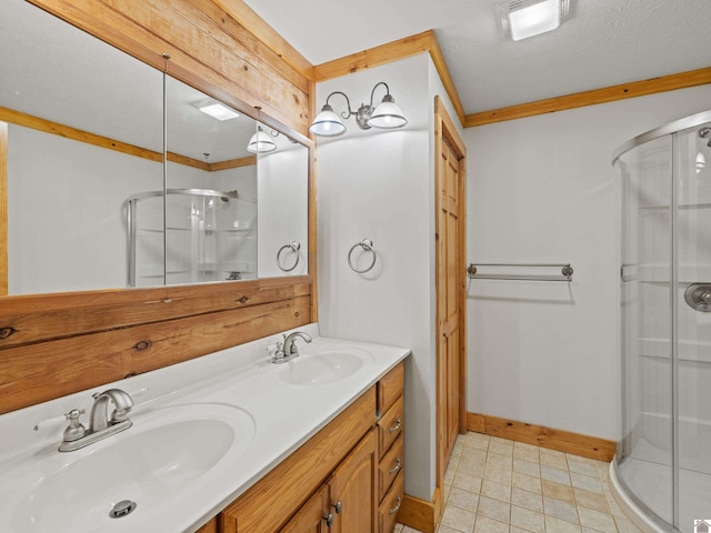 bathroom with walk in shower, crown molding, a textured ceiling, and vanity