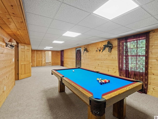 rec room with billiards, light colored carpet, and wooden walls