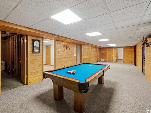 game room featuring carpet flooring, billiards, wooden walls, and a drop ceiling