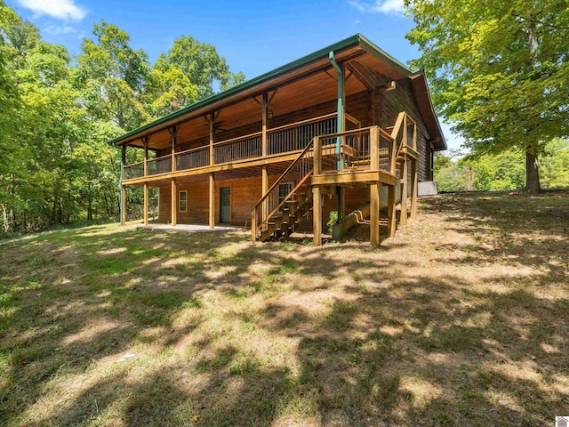 back of property with a patio and a deck