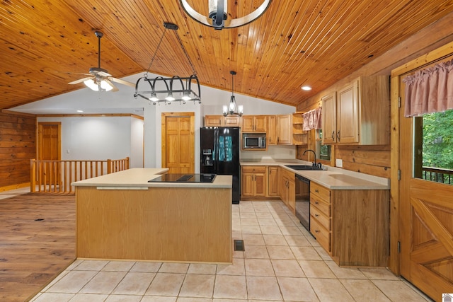 kitchen with vaulted ceiling, ceiling fan with notable chandelier, black appliances, a center island, and sink