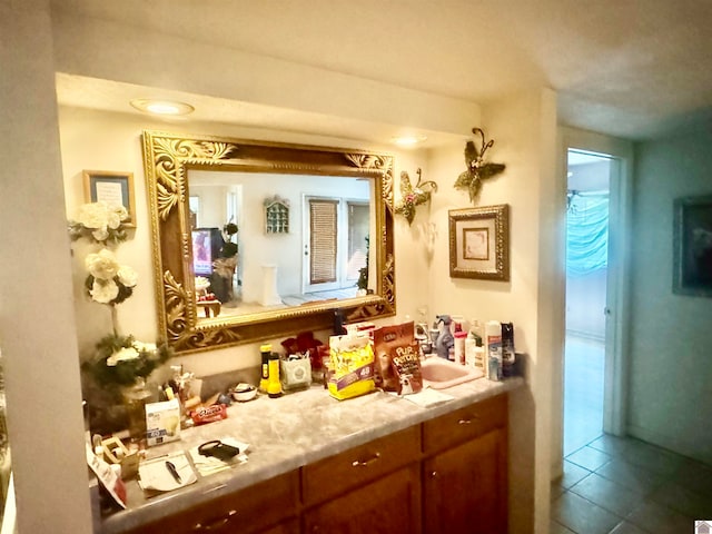 interior space with sink and tile patterned flooring