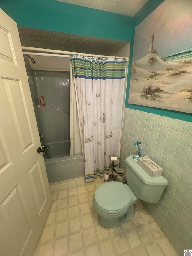 bathroom with toilet, tile walls, and shower / tub combo