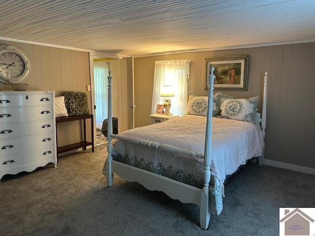 carpeted bedroom featuring crown molding