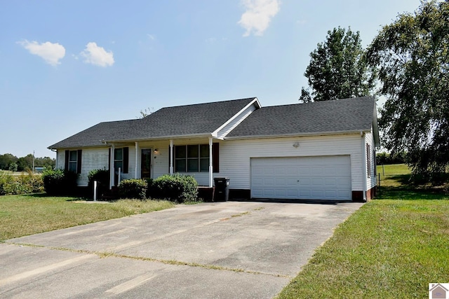 ranch-style home with a front yard and a garage