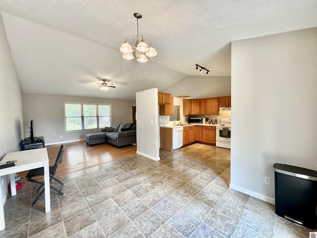 kitchen featuring hanging light fixtures, vaulted ceiling, ceiling fan with notable chandelier, white appliances, and a textured ceiling