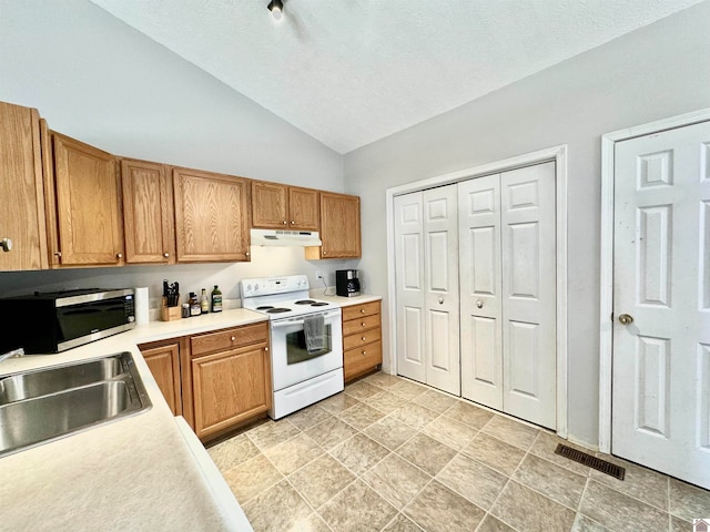 kitchen with lofted ceiling, sink, electric range, and a textured ceiling