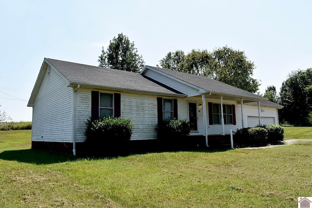 ranch-style home with a front lawn and a garage