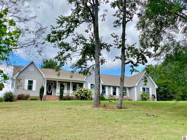 ranch-style house featuring a front lawn and a porch