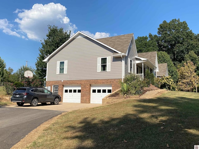 view of home's exterior featuring a yard and a garage