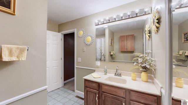 bathroom with vanity and tile patterned floors