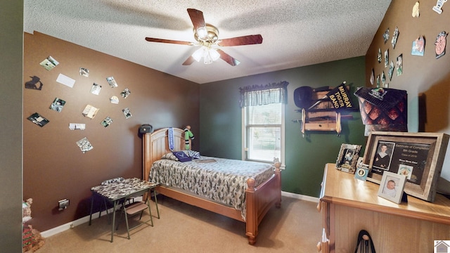 bedroom with carpet flooring, ceiling fan, and a textured ceiling