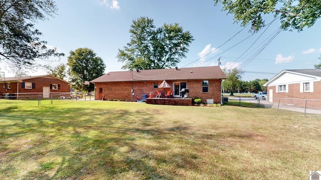 rear view of house with a lawn