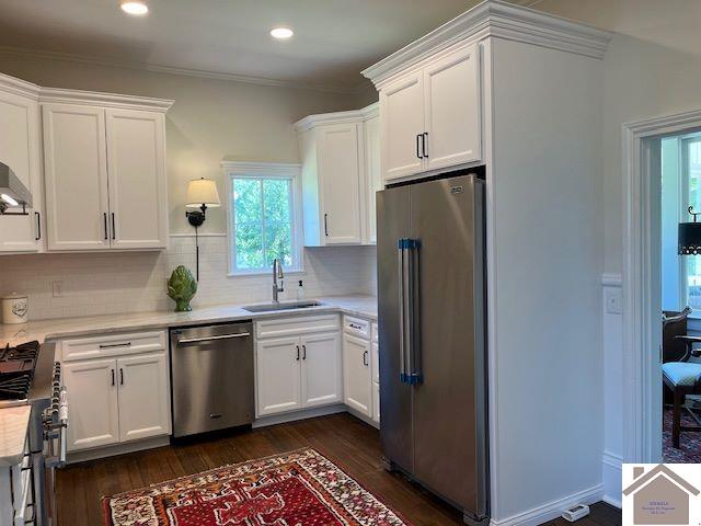 kitchen with white cabinets, stainless steel appliances, and sink