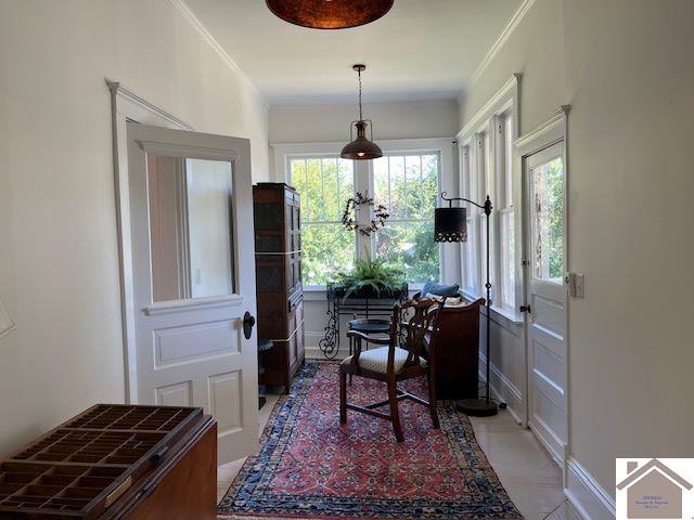 tiled office featuring crown molding