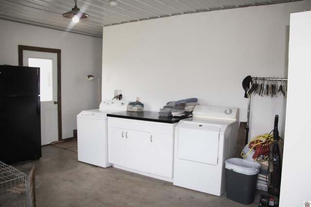 laundry room featuring ceiling fan, separate washer and dryer, and cabinets