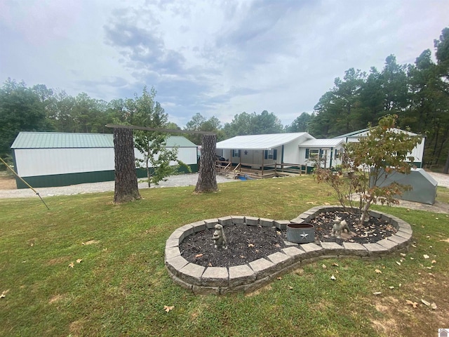 view of yard with a fire pit