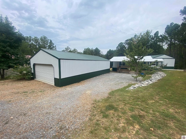 garage featuring a yard