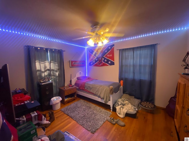 bedroom featuring ceiling fan and hardwood / wood-style floors