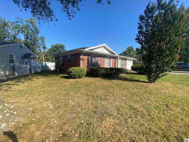 view of property exterior with a yard