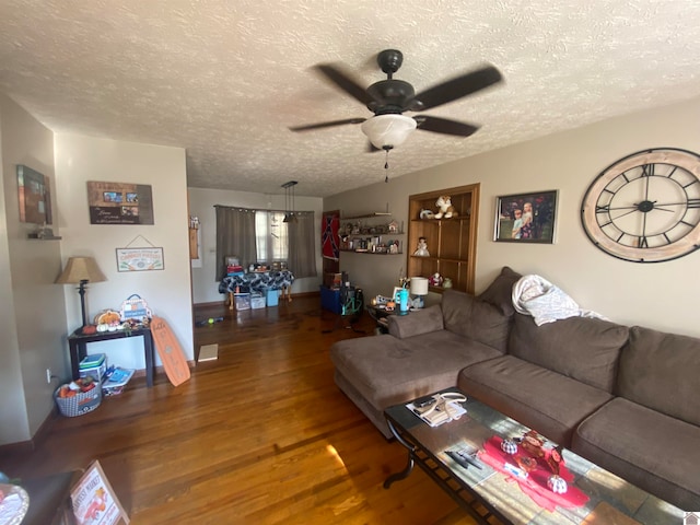 living room featuring a textured ceiling, hardwood / wood-style flooring, and ceiling fan